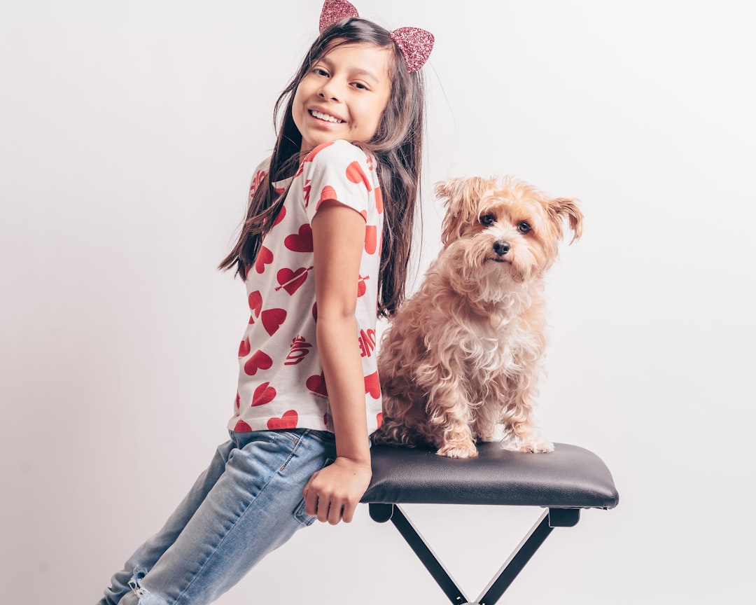 girl-in-pink-and-white-polka-dot-shirt-and-blue-denim-jeans-sitting-on-black-chair-een1eiurzyy